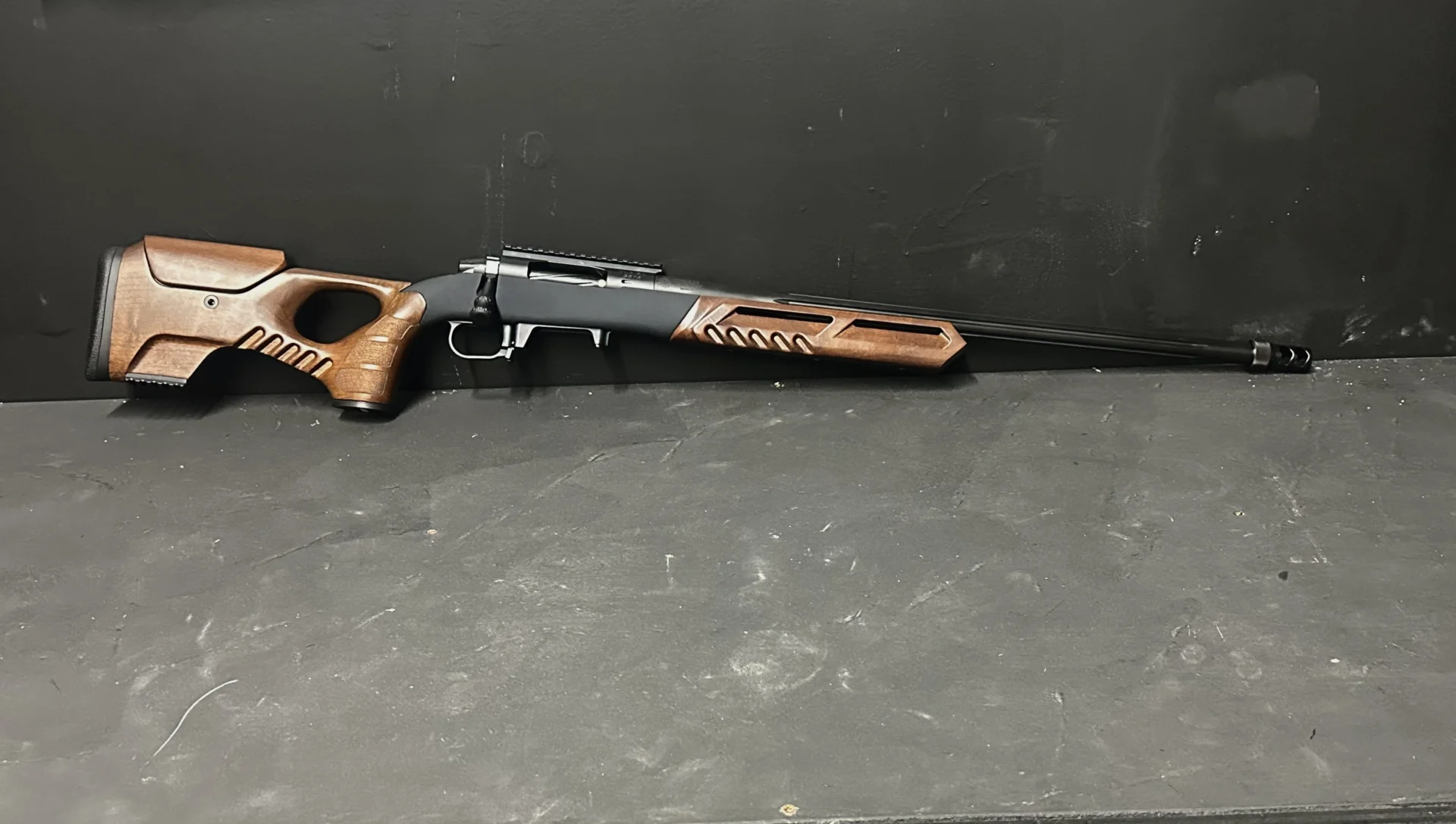 Custom rifle with sculpted wood stock