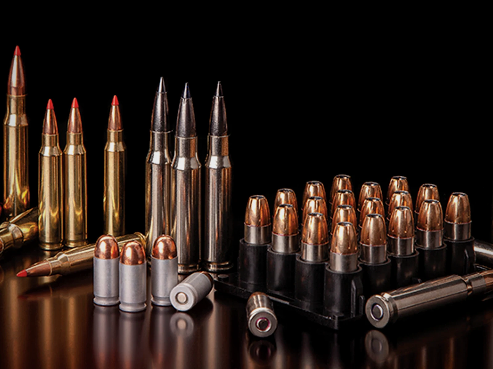 Assortment of rifle and handgun ammunition in multiple calibers
