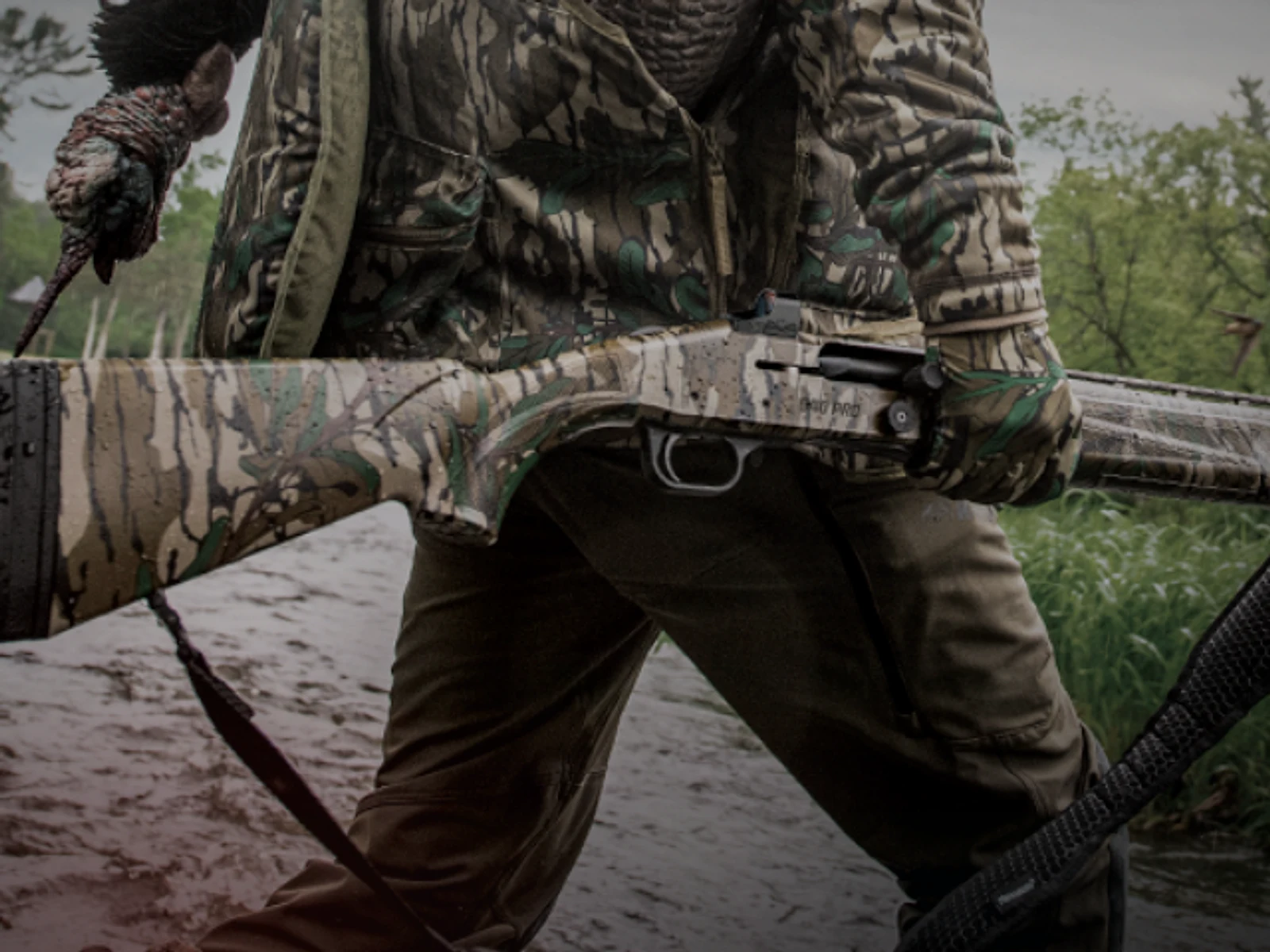 Hunter carrying a shotgun during a field hunt