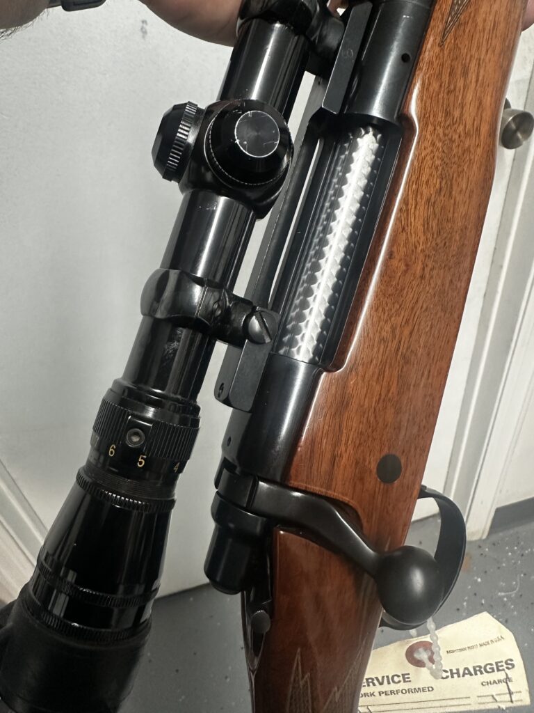 Rifle action, bolt and scope photographed at Windage Weaponry