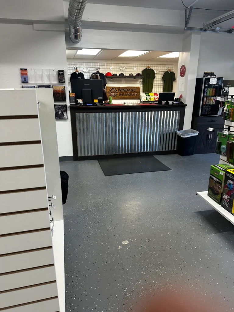 View from the entrance toward the front counter and merchandise at Windage Weaponry